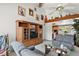 Living room with built-in shelving and large TV at 22777 Sw Surf Blvd, Dunnellon, FL 34431