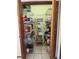 Walk-in pantry with extensive shelving, offering ample storage for food and supplies at 22777 Sw Surf Blvd, Dunnellon, FL 34431