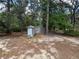 A pair of sheds and a small shed surrounded by lush foliage at 22777 Sw Surf Blvd, Dunnellon, FL 34431
