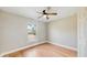 Well-lit bedroom with wood-look floors and ceiling fan at 2308 Sw 168Th Loop, Ocala, FL 34473