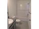 Clean bathroom with white subway tile and gray vanity at 24162 Nw Hemlock Ave, Dunnellon, FL 34431