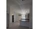 Modern kitchen featuring gray cabinets and an island at 24162 Nw Hemlock Ave, Dunnellon, FL 34431