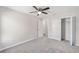 Bright bedroom with carpeted floors and ceiling fan at 24300 Sw Sea Cliff Ave, Dunnellon, FL 34431