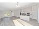 Modern kitchen with white cabinets, island, and stainless steel appliances at 24300 Sw Sea Cliff Ave, Dunnellon, FL 34431