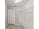 Laundry room with wire shelving and vinyl flooring at 24300 Sw Sea Cliff Ave, Dunnellon, FL 34431