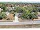 Aerial view of a single-story house with a driveway and yard at 281 Marion Oaks Crse, Ocala, FL 34473