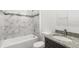 Bathroom with granite vanity, tiled shower and tub at 281 Marion Oaks Crse, Ocala, FL 34473