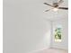 Bright bedroom with ceiling fan, large window, and neutral walls at 281 Marion Oaks Crse, Ocala, FL 34473