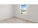 Bright bedroom with tile floors and a large window at 281 Marion Oaks Crse, Ocala, FL 34473