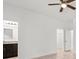 Primary bedroom with ceiling fan, private bathroom access, and walk-in closet at 281 Marion Oaks Crse, Ocala, FL 34473
