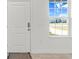 Interior entryway with white door and window, view to backyard at 281 Marion Oaks Crse, Ocala, FL 34473