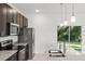 Modern kitchen with granite countertops, stainless steel appliances, and ample cabinet space at 281 Marion Oaks Crse, Ocala, FL 34473