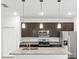 Granite countertops and dark kitchen cabinets at 281 Marion Oaks Crse, Ocala, FL 34473