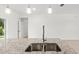 Granite countertop kitchen island with double sink and modern faucet at 281 Marion Oaks Crse, Ocala, FL 34473