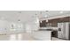Modern kitchen with dark cabinetry, granite countertops, and stainless steel appliances at 281 Marion Oaks Crse, Ocala, FL 34473