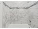 Shower with marble-tiled walls and accent tile at 281 Marion Oaks Crse, Ocala, FL 34473
