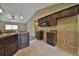 Open concept kitchen with dark wood cabinets and tile floor at 2859 Se 145 St, Summerfield, FL 34491