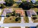 Aerial view of three houses on a residential street at 3333 Nw 47Th Ct, Ocala, FL 34482