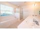Bathroom with a soaking tub, double vanity, and a separate shower at 3333 Nw 47Th Ct, Ocala, FL 34482