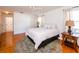 Light and airy bedroom with wood floors, ceiling fan and access to a bathroom at 3333 Nw 47Th Ct, Ocala, FL 34482