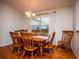 Charming dining room featuring a wood table and hardwood floors at 3333 Nw 47Th Ct, Ocala, FL 34482