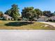 Single-Gathering home with large tree in front yard at 3333 Nw 47Th Ct, Ocala, FL 34482