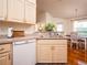 Galley kitchen with light wood cabinets and modern appliances at 3333 Nw 47Th Ct, Ocala, FL 34482