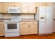 Bright kitchen features white appliances and light wood cabinets at 3333 Nw 47Th Ct, Ocala, FL 34482
