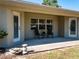 Covered patio with seating area and access to house at 3333 Nw 47Th Ct, Ocala, FL 34482
