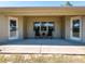 Covered patio with seating area and double doors at 3333 Nw 47Th Ct, Ocala, FL 34482