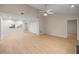 Bright living room with a pass-through to the kitchen and closet doors at 3856 Ne 19Th Street Cir, Ocala, FL 34470