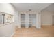 Open-concept living room with a pass-through view to the kitchen and white closet doors at 3856 Ne 19Th Street Cir, Ocala, FL 34470