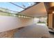 Enclosed patio with a ceiling fan and view of greenery at 3856 Ne 19Th Street Cir, Ocala, FL 34470