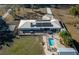 Aerial view showcasing home with solar panels, pool, and expansive lot at 4005 Sw 183Rd Ter, Dunnellon, FL 34432