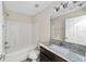 Clean bathroom with granite vanity and a bathtub at 4069 Sw 130Th Pl, Ocala, FL 34473