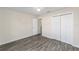 Spacious bedroom with double door closet and wood-look floors at 4069 Sw 130Th Pl, Ocala, FL 34473