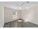 Well-lit bedroom featuring wood-look floors and a ceiling fan at 4069 Sw 130Th Pl, Ocala, FL 34473