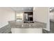 Granite kitchen island with double sink and modern faucet at 4069 Sw 130Th Pl, Ocala, FL 34473