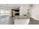 Modern kitchen with granite island and stainless steel appliances at 4069 Sw 130Th Pl, Ocala, FL 34473