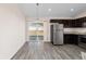 Kitchen with stainless steel appliances and sliding glass doors at 4069 Sw 130Th Pl, Ocala, FL 34473