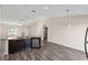 Modern kitchen features dark brown cabinetry, stainless steel appliances and a large island at 4069 Sw 130Th Pl, Ocala, FL 34473