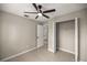 Bedroom with ceiling fan and access to closet and bathroom at 4677 Sw 166Th Loop, Ocala, FL 34473
