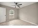 Well-lit bedroom with arched window and ceiling fan at 4677 Sw 166Th Loop, Ocala, FL 34473