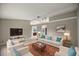 Bright living room featuring comfortable seating and large TV at 4677 Sw 166Th Loop, Ocala, FL 34473