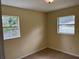 Bedroom with two windows and neutral walls at 5473 Nw 62Nd Pl, Ocala, FL 34482