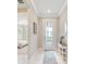 View of bedroom and foyer with tile floors at 5695 Sw 94Th Ave, Ocala, FL 34481