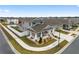Two-story house with a front porch, two-car garage, and fenced backyard; aerial view at 6115 Sw 74Th Ct, Ocala, FL 34474