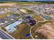 Aerial view of community with pool, playground, and basketball court at 6115 Sw 74Th Ct, Ocala, FL 34474