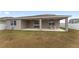 House with covered patio and grassy backyard at 6115 Sw 74Th Ct, Ocala, FL 34474