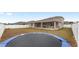 Large backyard with trampoline and view of house at 6115 Sw 74Th Ct, Ocala, FL 34474